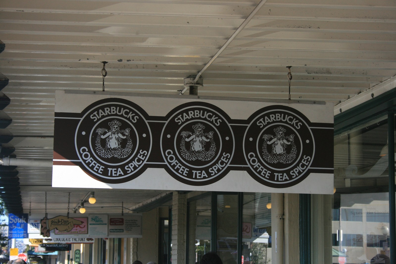 Original-style Starbucks siren signs at1912 Pike Place, photographed in2008