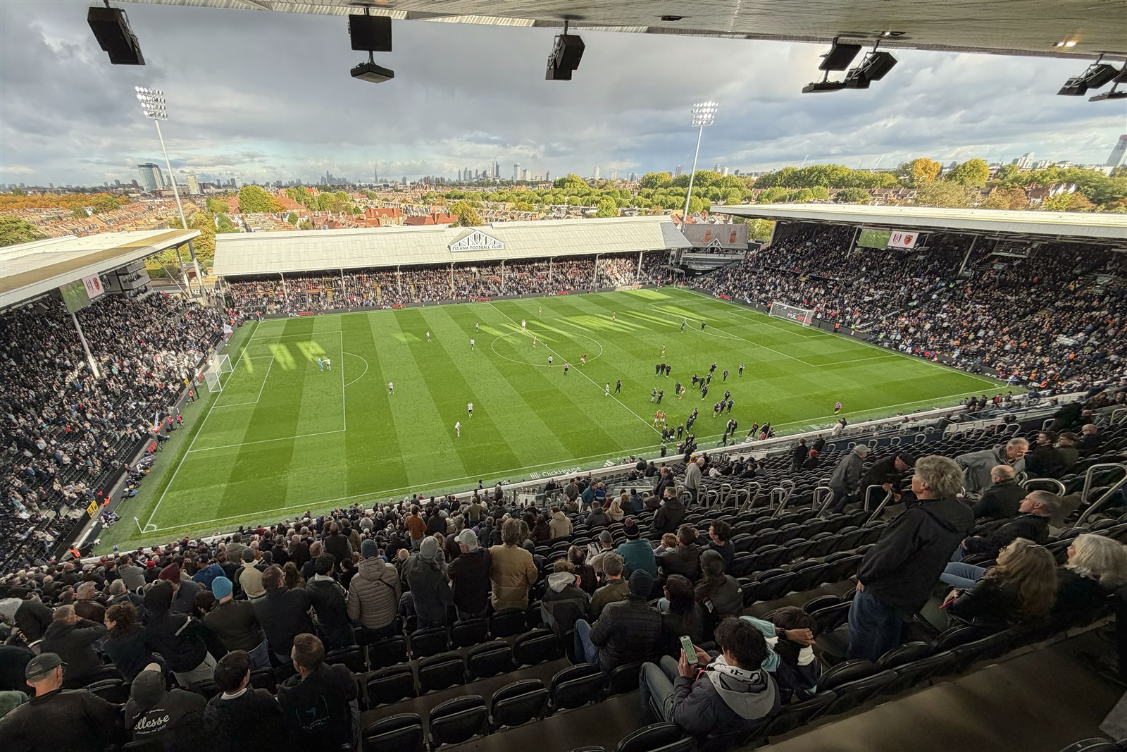 A match at Craven Cottage viewed from the Riverside Stand, with the Johnny Haynes Stand opposite.