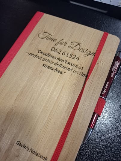 Engraved notebook and pen with personalised wording