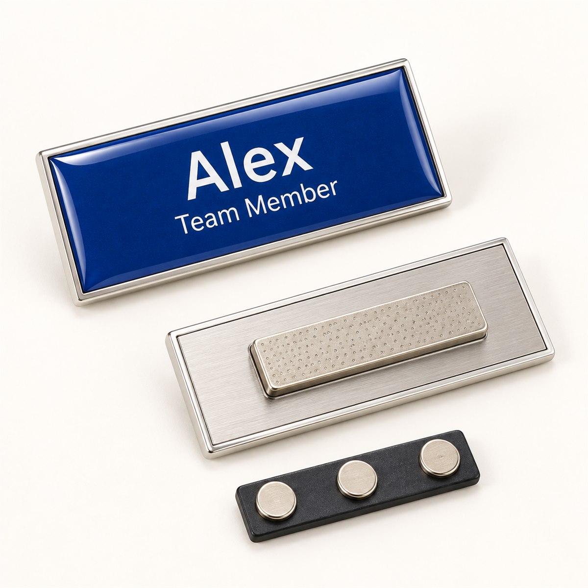 Front and reverse of a domed badge with a magnetic name-badge fixing