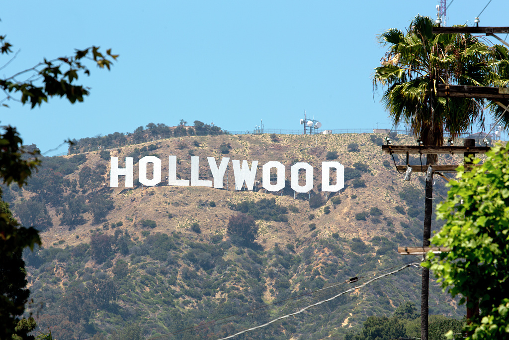 The modern Hollywood Sign in white letters on the hillside above Los Angeles