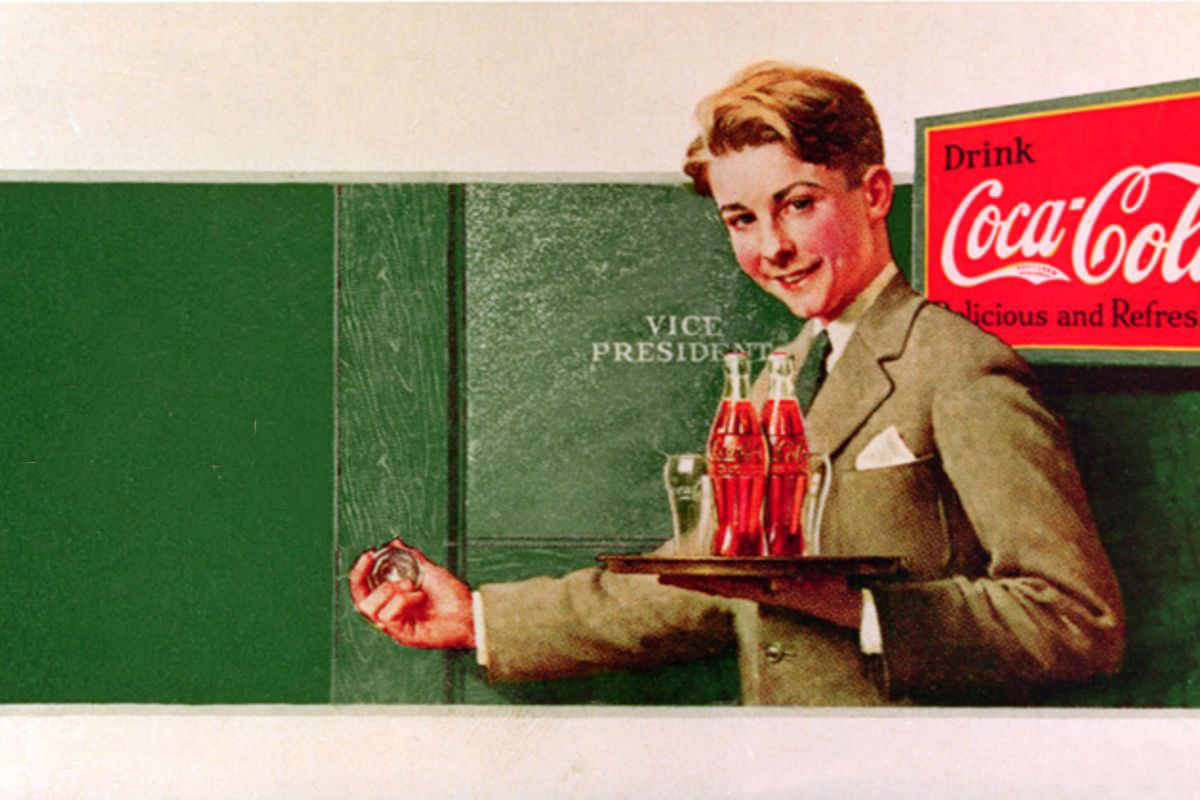 Historical Coca-Cola advertising image of a man holding a glass of cola
