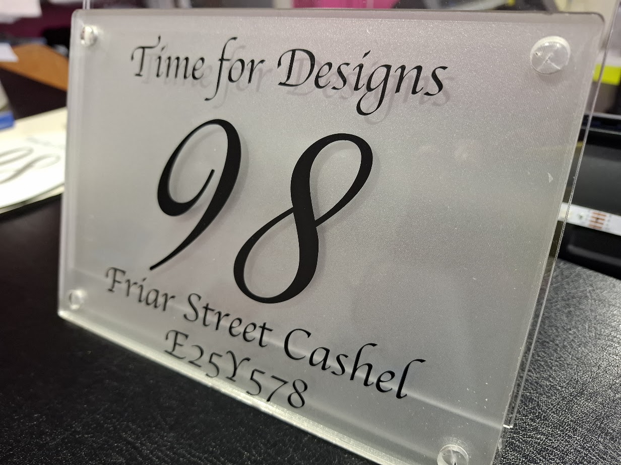 Rectangular personalised house number and address plaque showing a large number and Eircode