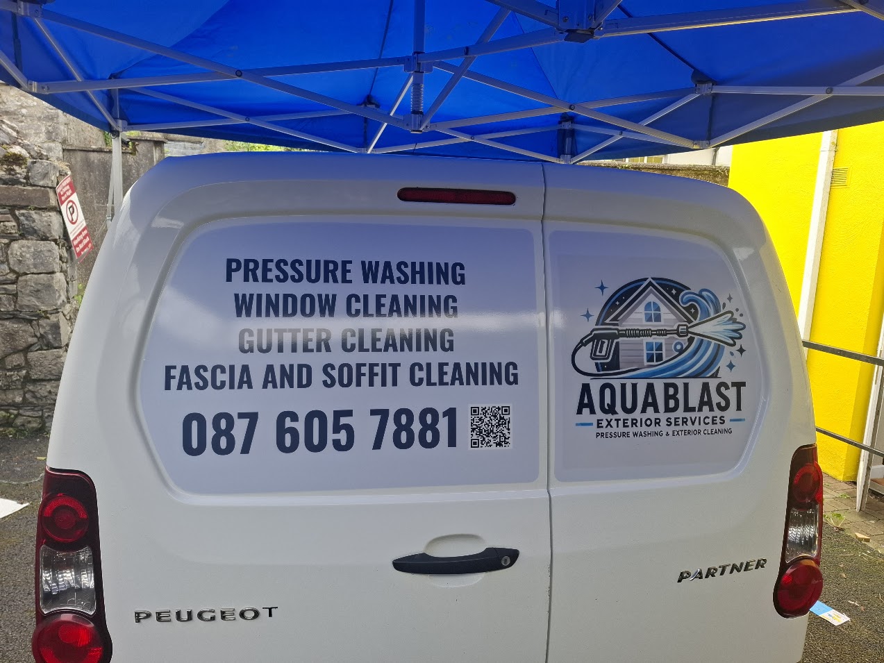 AquaBlast service van rear-door lettering with logo, services, phone number and QR code