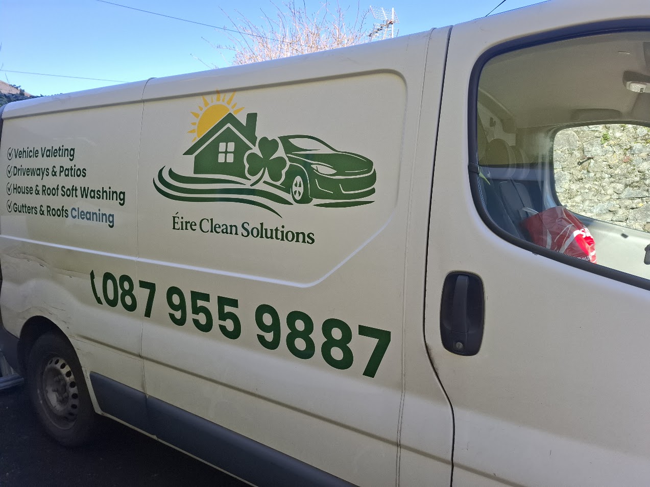 Eire Clean Solutions van with green logo, service list and large phone-number lettering