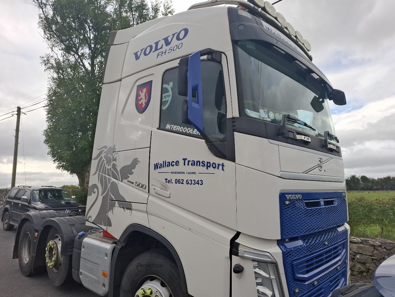 Wallace Transport Volvo truck cab with company-name and contact-detail lettering